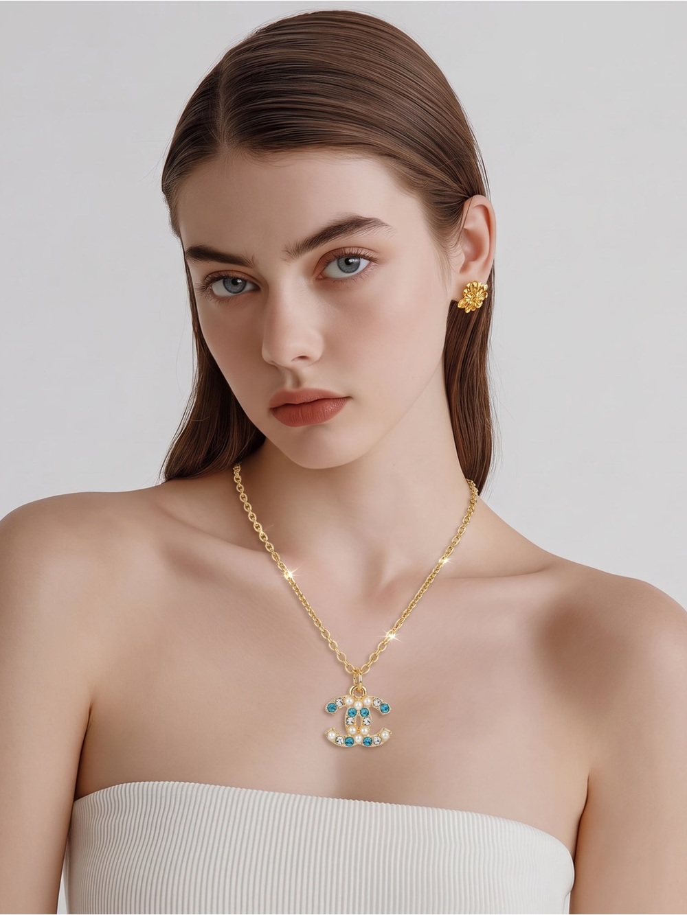 Gold Chain Necklace with Blue and Clear Gemstone Pendant